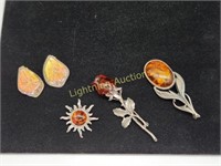 THREE STERLING SILVER AMBER BROOCHES AND EARRINGS