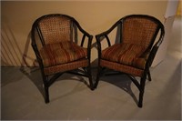 2 wooden wicker back chairs .