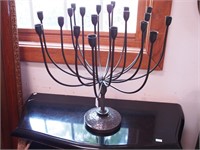Black metal candleholder in the mid-century