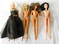 Four Barbie dolls.
