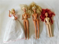 Four more Barbie dolls.
