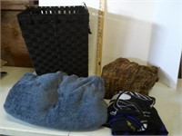 lot of throw blankets and hamper