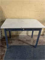 PORCELAIN TOP TABLE W/ CENTER DRAWER AND TWO