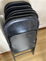 8 black metal folding chairs