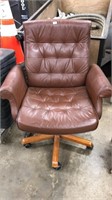 UPHOLSTERED ROLLING ARM CHAIR