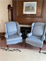 Two light blue wing back chairs