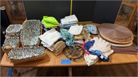 Placemats, metal hot plates, rags, baskets