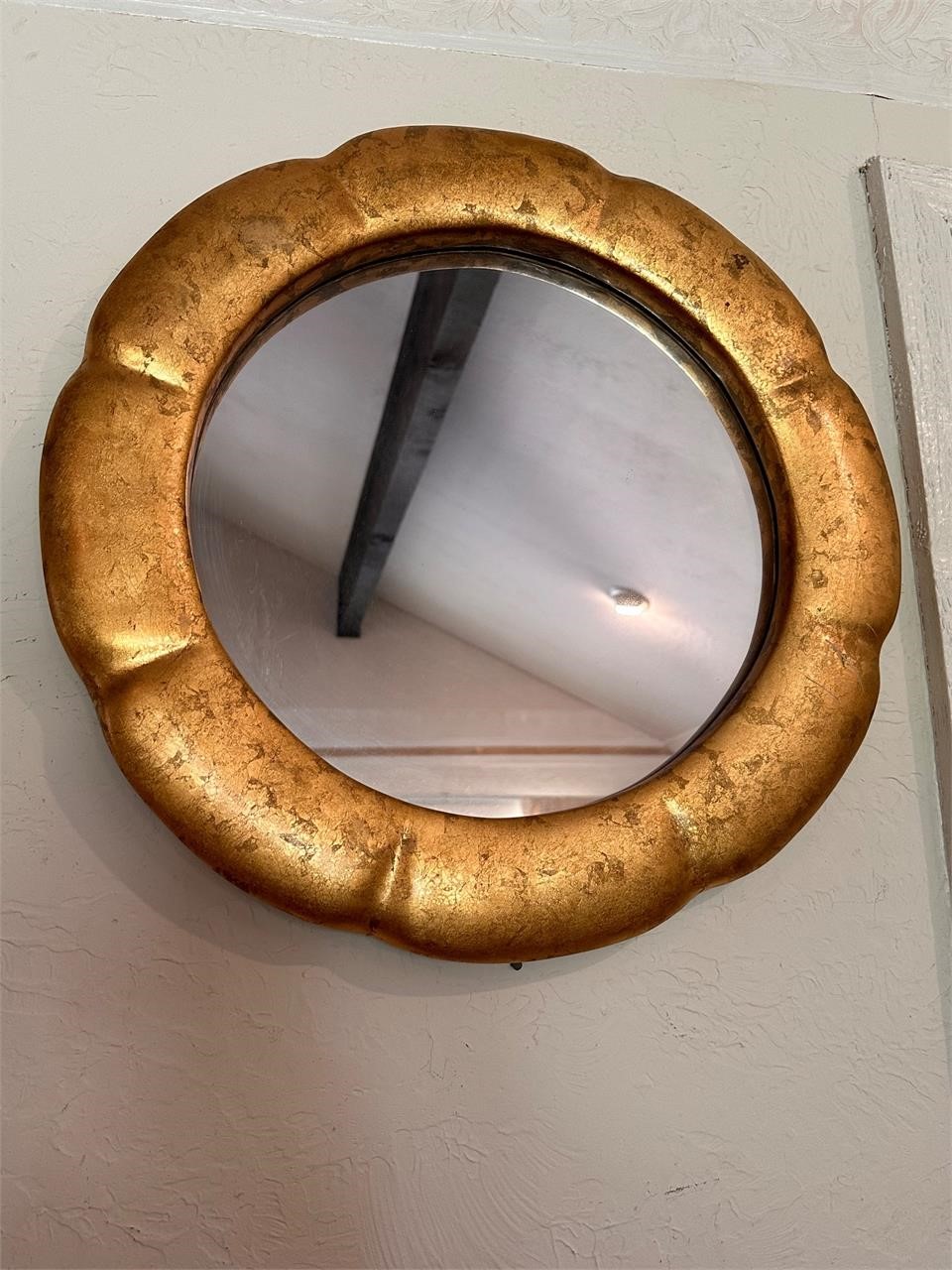 Gold round mirror