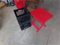 2 plastic crates and red table