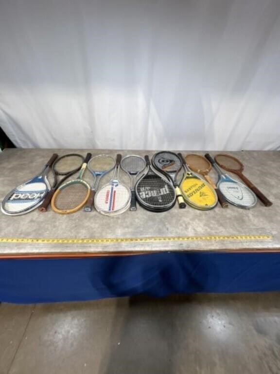 Assortment of wood and metal tennis rackets