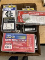 Nine new containers full of sheet metal screws,