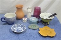 Assorted ceramic, clay and glass items.