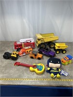 Toy trucks and fire truck, Batman stuffed toy,