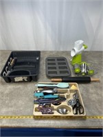 Assortment of kitchen utensils, baking pan,
