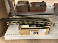 Box of metal/plastic train tracks.