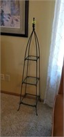 Wrought iron stand with glass shelves