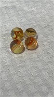 4 11/16 +/- tiger eye type marbles slight