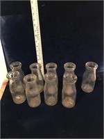 9 small milk bottles