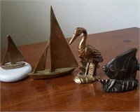 Brass figures, sailboats, crane and fish
