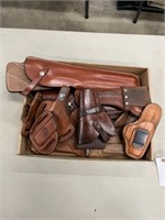 assorted brown leather holsters