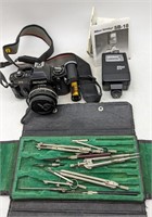 (O) Drafting tools and a Nikon FG 35mm camera