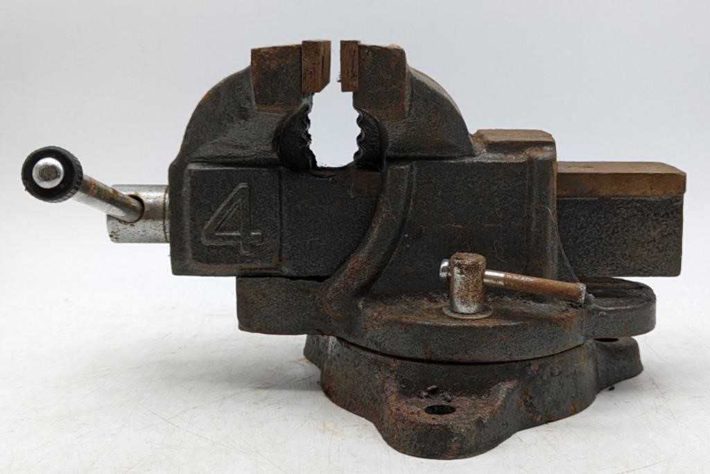 (O) Swivel bench vise with 4" clamp.