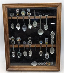 (O) Souvenir spoon display case with spoons.