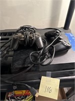 PlayStation 4 with two controllers and power cord