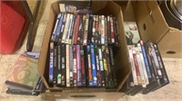 Box lot with about 70 movie DVDs.