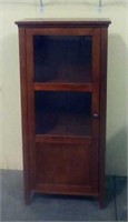 Small curio cabinet with glass door