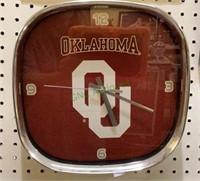 Quartz wall clock featuring Oklahoma University.