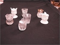 Six toothpick holders: four are glass, one with