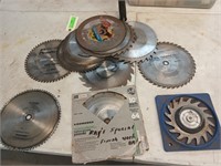 14 10-in used saw blades and an adjustable dado