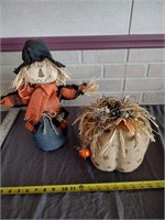 Fall scarecrow and large pumpkin decor