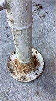 Antique well pump, painted white