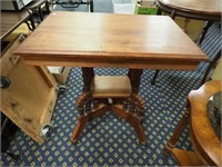 Eastlake walnut parlor table with undershelf and