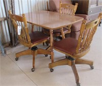 Small kitchen table with 3 rolling chairs