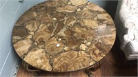 Polished stone top coffee table. Very heavy.
