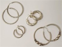 Four various pairs of silver hoop earrings