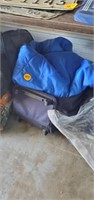 ROLLING SUITCASE AND BLUE SLEEPING BAG