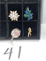 Four broaches/pins