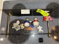 Hanging glass shelf with snowman figurines