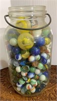 Mason jar filled with glass marbles - including