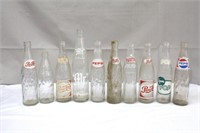 Collection of 10 pop bottles including Pepsi, Pop