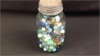 Blue ball jar with vintage marbles