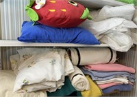 Lot of various blankets, sheets, and pillows