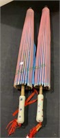 Two oriental umbrellas made of wood and silk