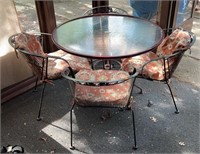 Outdoor patio table with glass top & 4 chairs.