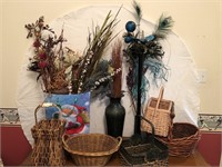 Decor with baskets, dried stems, and feathers