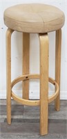 Contemporary blonde wood stool with leather seat